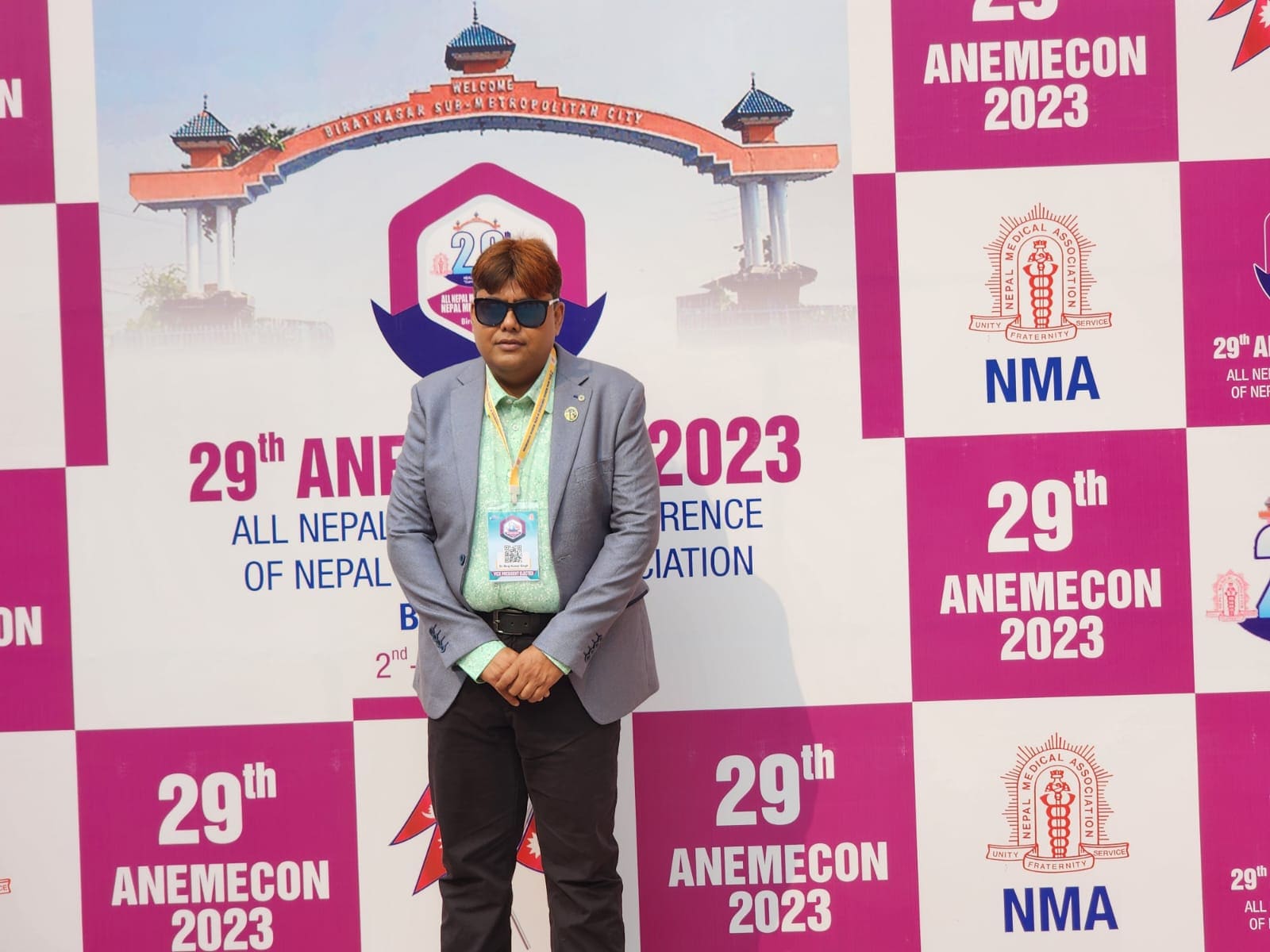 Dr. Niraj Kumar Singh at the 29th ANEMECON 2023 backdrop in Biratnagar, wearing a Vice President Elect delegate badge.