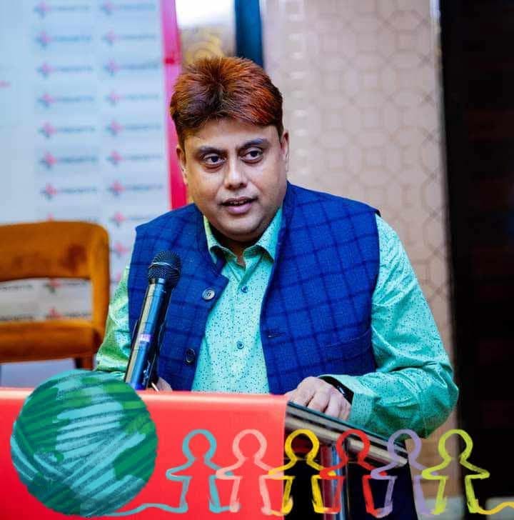 Dr. Niraj Kumar Singh speaking at a lectern during a health awareness seminar in Birgunj.