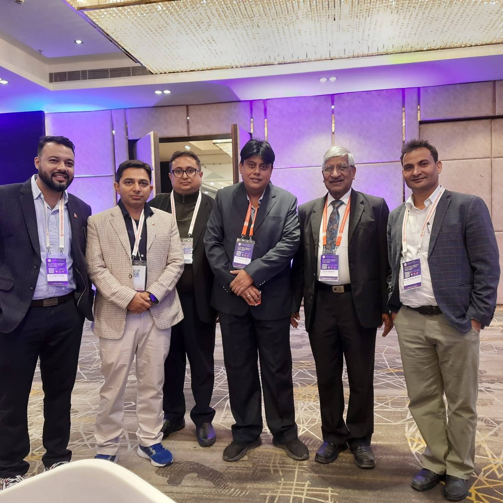 Dr. Niraj Kumar Singh with fellow delegates at the SIMON 2025 conference in Lalitpur.
