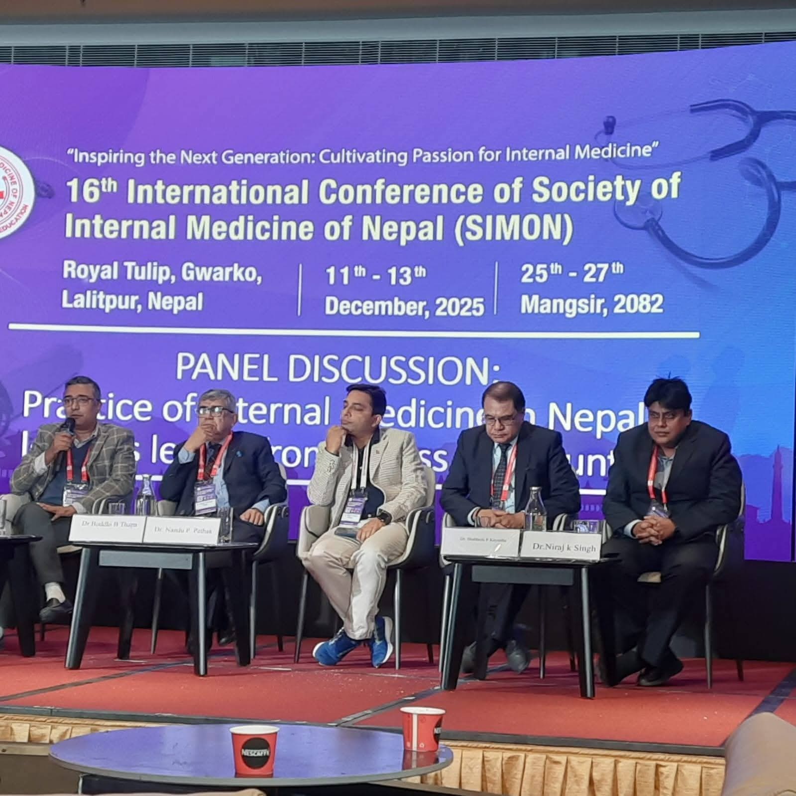 Dr. Niraj Kumar Singh seated with fellow panellists at the 16th International Conference of the Society of Internal Medicine of Nepal, December 2025.